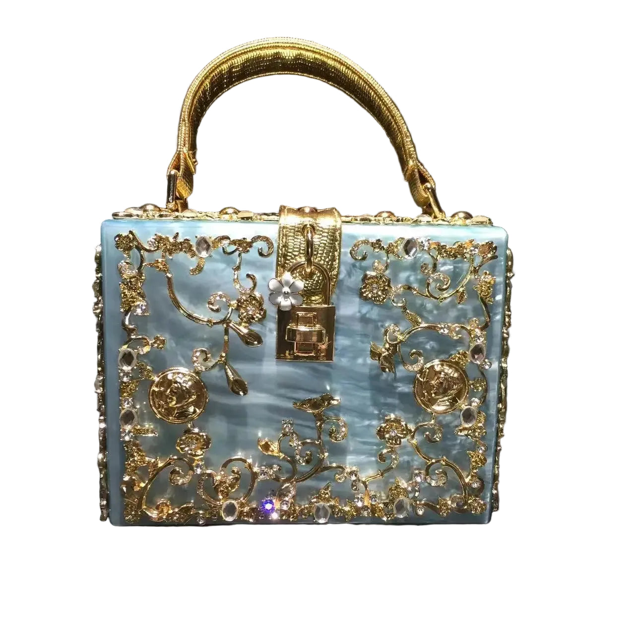Decorative handbag with gold embellishments on a black background