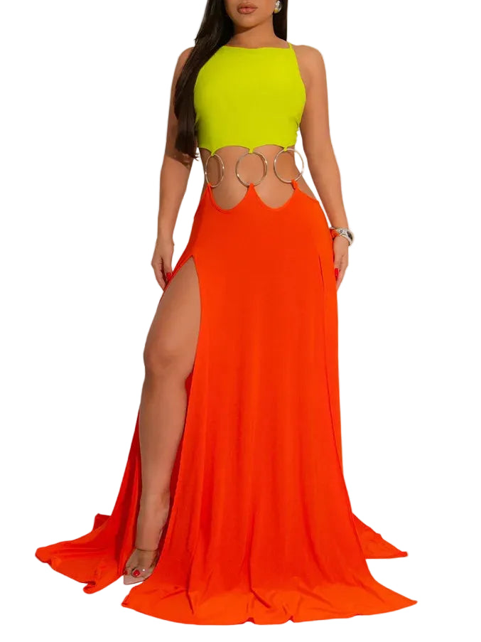Woman wearing a bright green top and orange skirt with cut-out design on a gray background.