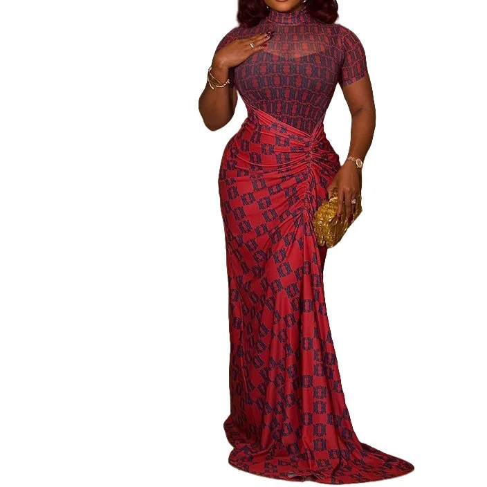 Woman wearing a red and black patterned evening gown on a white background