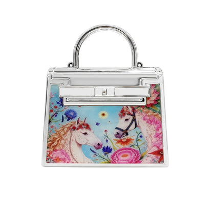 Handbag with unicorn and floral design on a white background