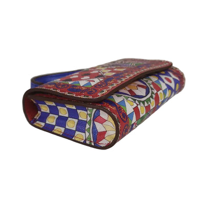 Colorful patterned wallet on a plain background