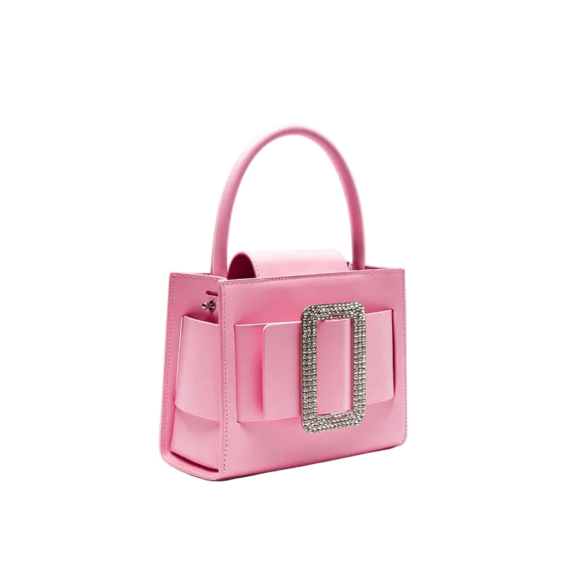 Pink handbag with decorative clasp on a light gray background, featuring the brand 'Bafelli'.