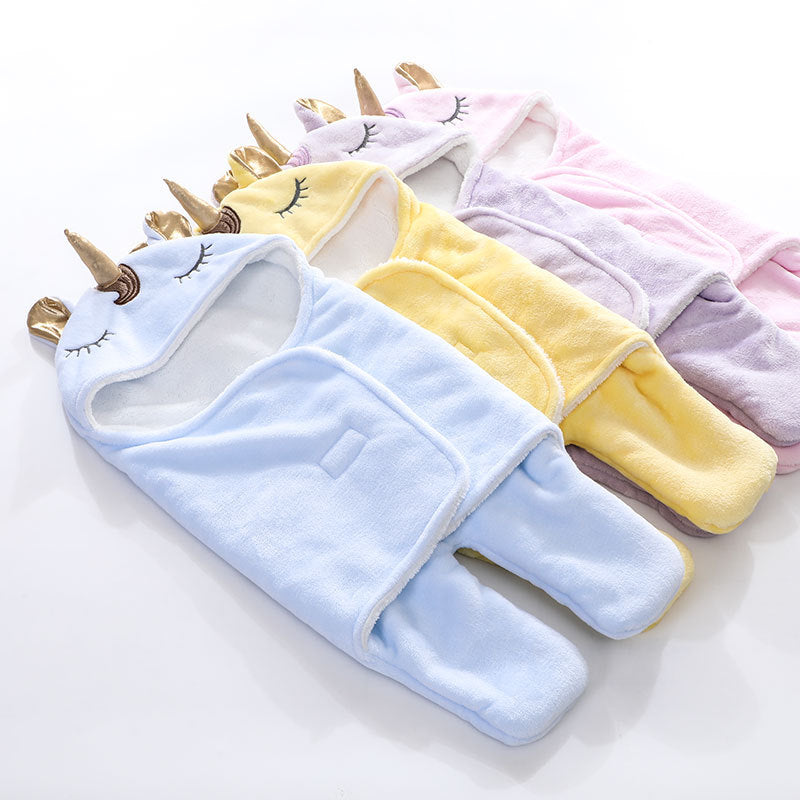 Unicorn baby holding blanket
