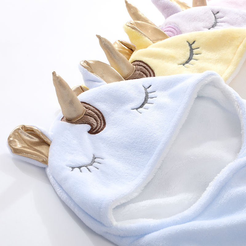Unicorn baby holding blanket
