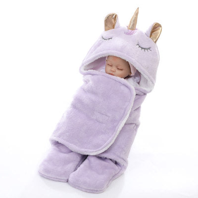 Unicorn baby holding blanket